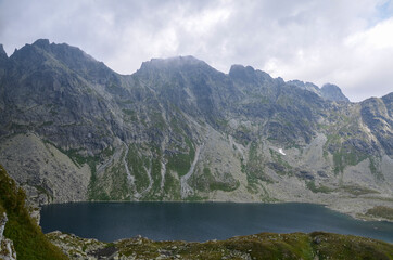 Naklejka na ściany i meble Mountain lake Velke Hincovo pleso under peak Mengusovsky stit in Mengusovska valley in the national park of High Tatras - Slovakia