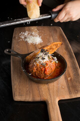 Meatballs. Classic Italian or Greek restaurant favorite. Ground meat mixed with onions, garlic, herbs, eggs, bread crumbs, spices, fried. and sautéed in homemade marinara sauce and cheese.