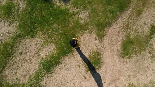 Aerial zoom shot of a man drone in nature