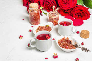 Tea time with rose petals jam and hot beverage