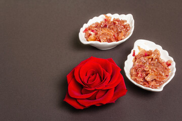 Homemade rose petals jam in bowl and glass jar