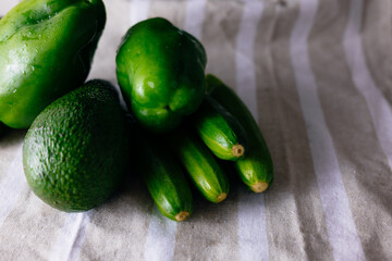 Fresh baby zucchini on a towel.