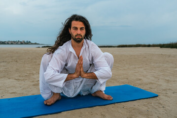 Concentrated Man Practicing Yoga Outdoors