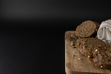 French baguette broken into pieces on a white kitchen towelwith a copy space. Top view