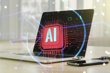 Double exposure of creative artificial Intelligence abbreviation with computer on background....