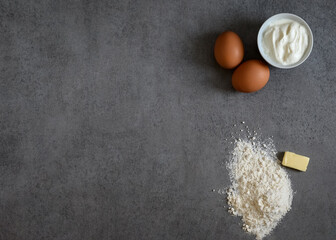Baking Ingredients Flour Eggs Cream. On Bright Grey Background. Top View Copy Space.