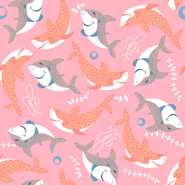 seamless pattern with cute smilling pink and blue baby sharks with leaves on pink background © StindyArt