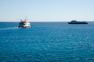 two ships sail at sea