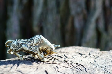 Metal bull figurine close-up. The symbol of 2021.