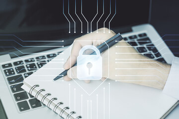 Creative lock illustration with microcircuit and hand writing in diary on background with laptop,...