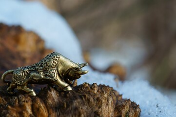 Metal bull figurine close-up. The symbol of 2021.