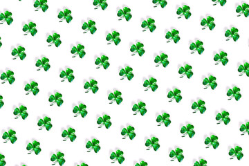 Seamless photo pattern. Shamrock symbol made of green decorative glass hearts lying on white background. Happy St. Patrick's Day Irish holiday card. Spring 17 march lucky clover design