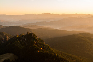 Scenic landscape of the mountains and the forest at sunrise