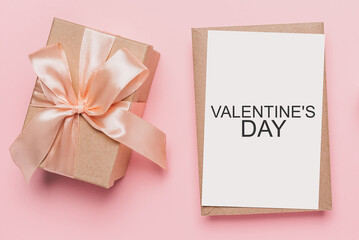 Gifts with note letter on isolated pink background, love and valentine concept with text Valentines Day