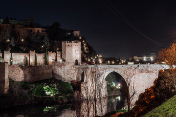 Alcantara Bridge Over Tagus River In Toledo, Spain At Night