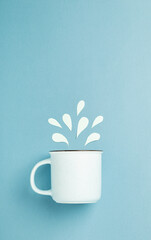 World water day concept with mug and paper cut water splashes