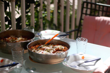 Quinoa and vegetable meal, served on the table outdoor. Selective focus.