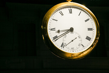 old clock in the city. Big round clock outside in front of a watch shop. Watches in Switzerland....
