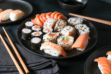 Japanese sushi food. Maki ands rolls with tuna, salmon, shrimp, crab and avocado. Top view of assorted sushi. sushi roll, uramaki, hosomaki and nigiri.