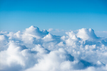 flight over the clouds. view of the clouds from the airplane window - obrazy, fototapety, plakaty