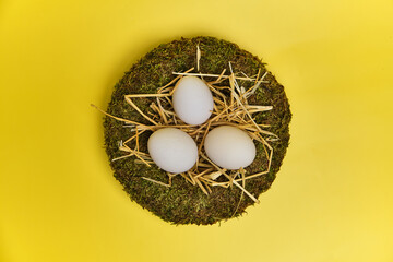 easter basket with easter eggs on Yellow background