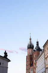 Krakow, Poland, main market square, view of a St Mary's church on a blue sky background