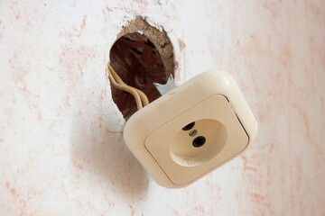 the electrical outlet fell out of the wall