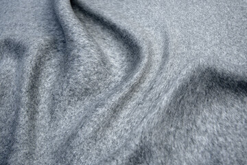 Fototapeta na wymiar .Close up texture of fabric for coat. Gray woolen fabric. Gray background.