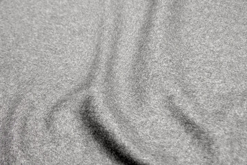 Fototapeta na wymiar Close up texture of fabric for coat. Gray woolen fabric. Gray background.