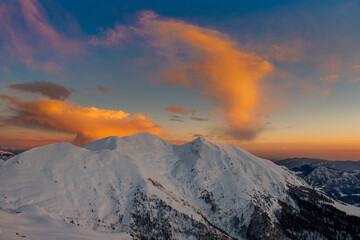 Fototapeta na wymiar Snowy mountain with clouds