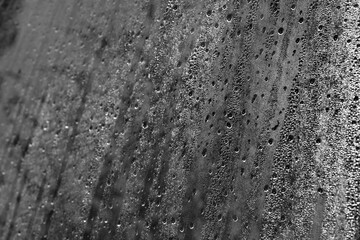 Mist and water drops on a glass