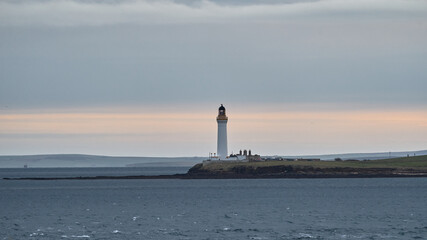 Lighthouse at Sunrise on a headland of an island