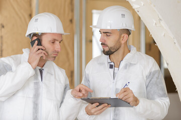 construction worker talking on cell phone