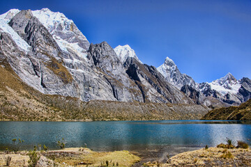 Obraz premium Laguna Siula and mountain panorama on the Cordillera Huayhuash circuit, Ancash, Peru