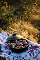 Vareniki with cherry in a ceramic bowl.