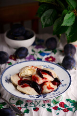 Vareniki with cherry in a ceramic bowl.