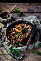 Veal ossobucco with green peas.selective focus
