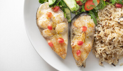 plate of healthy food, Fried trout. Wild whole grain rice porridge and salad.
