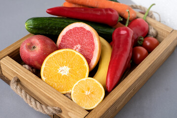 Fresh vegan fruits and vegetables on a tray for a healthy and healthy diet