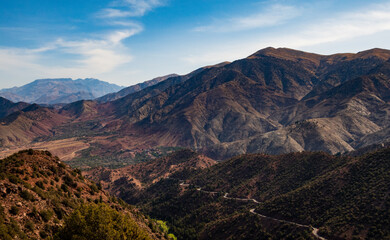 Naklejka na ściany i meble Hiking through the High Atlas Mountains of Morocco on a sunny day