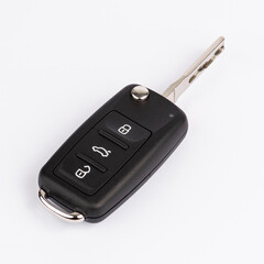 CAR KEY. Black color modern car key on white background..