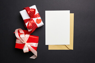 White blank greeting card or invitation and envelope on black