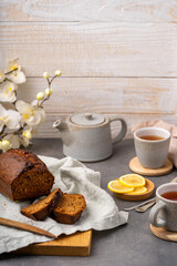 Homemade cake with cups of tea and teapot. Front view with copy space for a text. Selective focus. High quality photo