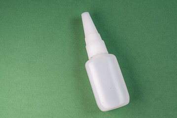 Glue bottle on the colorful background