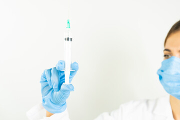 hand and syringe. corona vaccine