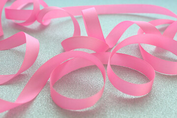 pink ribbon on silver background