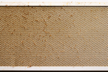 dirty clogged cooker hood filter from domestic kitchen. above view