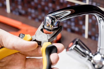 plumber repair faucet concept. unclog dirty clogged faucet aerator or mixer. plumbing conceptual