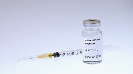 Disease outbreak. Medical syringe with needle for protection flu virus and coronavirus. Covid vaccine on white. Syringe, medical injection