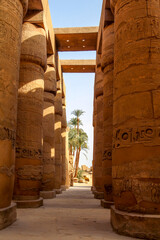 View through the majestic columns of Karnak temple through a gate